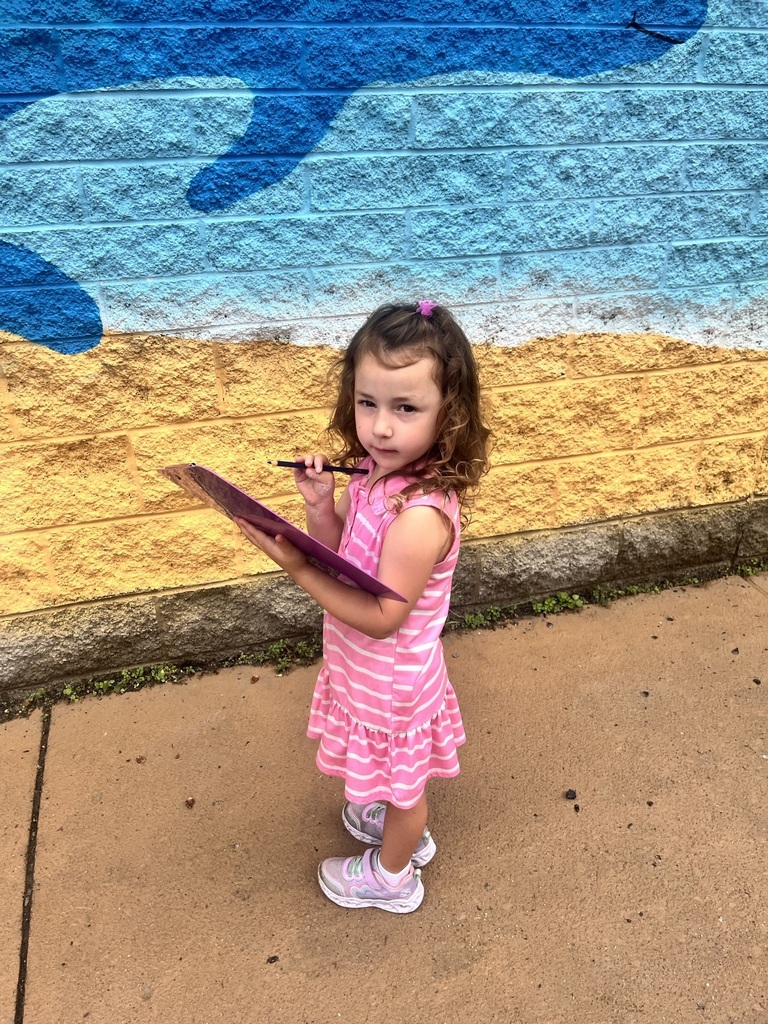 PreK student with a clipboard