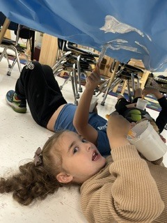 Pre K students painting clouds