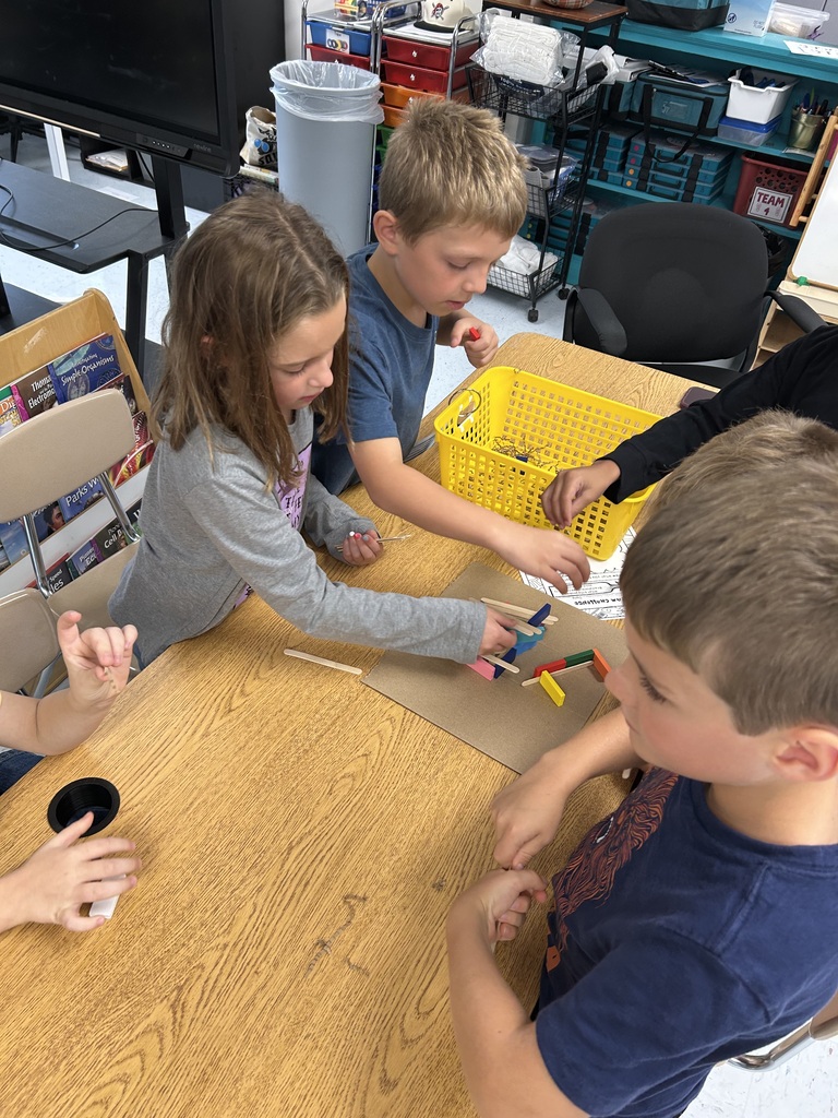Students seeing if their structure is strong enough for wind