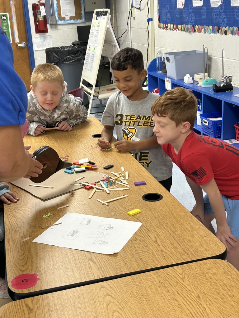 Students seeing if their structure is strong enough for wind