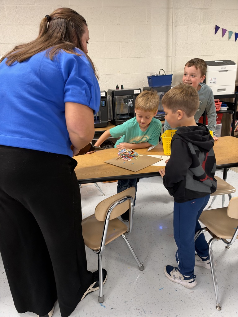Students seeing if their structure is strong enough for wind