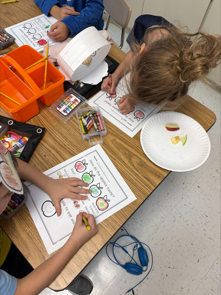 Kindergarten students tasting apples
