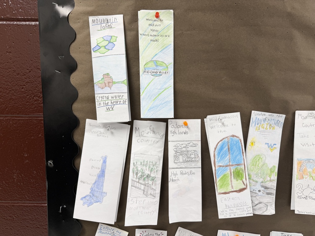 Student made WV brochures hanging on a bulletin board. 