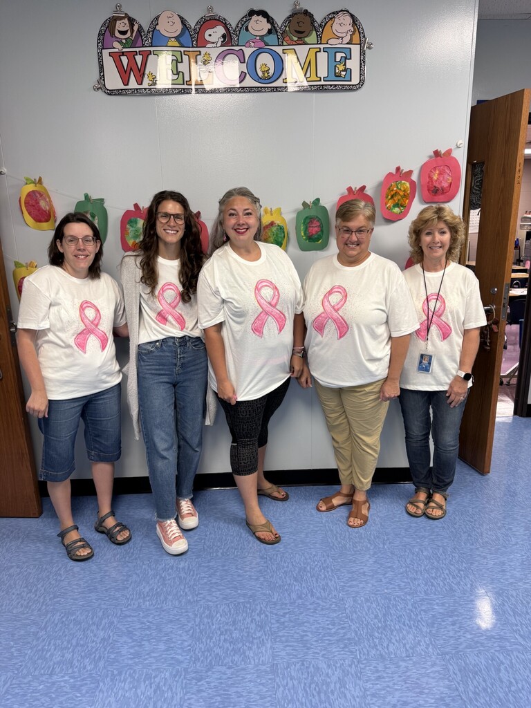 First grade teachers wearing pink ribbon t-shirts