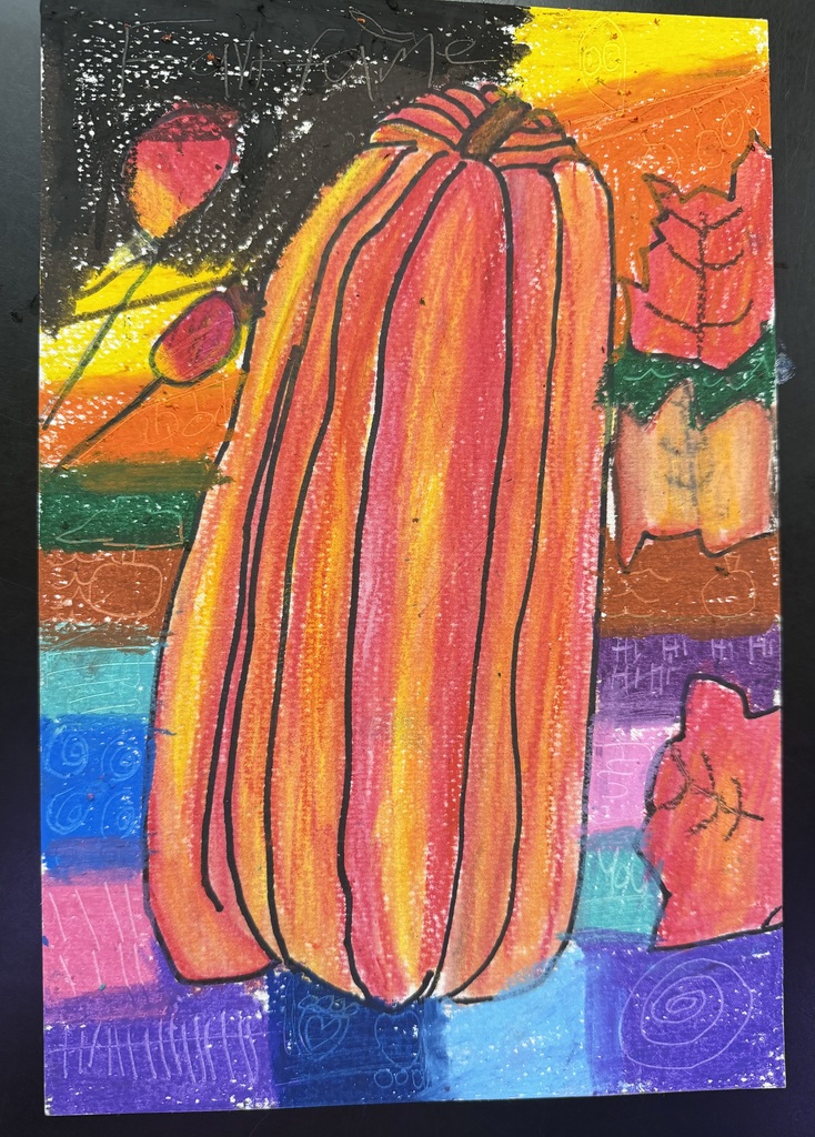 A piece of paper with an orange pumpkin, a few leaves, and colorful rectangular that is having the pumpkin sit on.