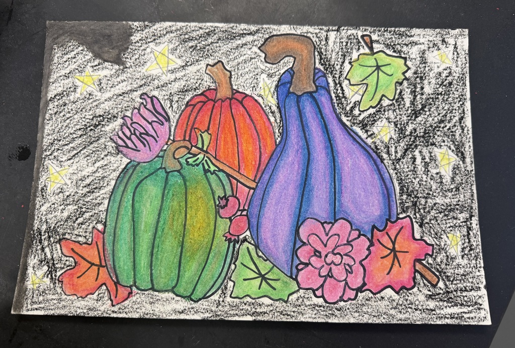 A piece of paper with an oil pastel painting on it. The painting has  leaves, flowers, a green and orange pumpkin and a gourd on it.