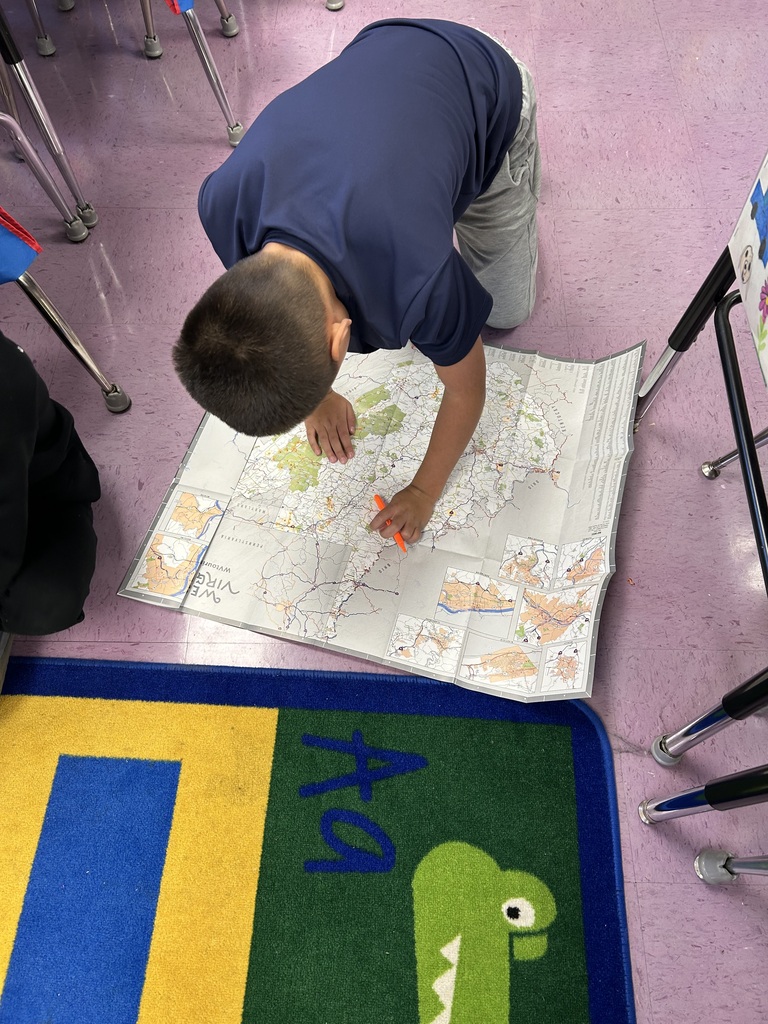 Student working on WV poster