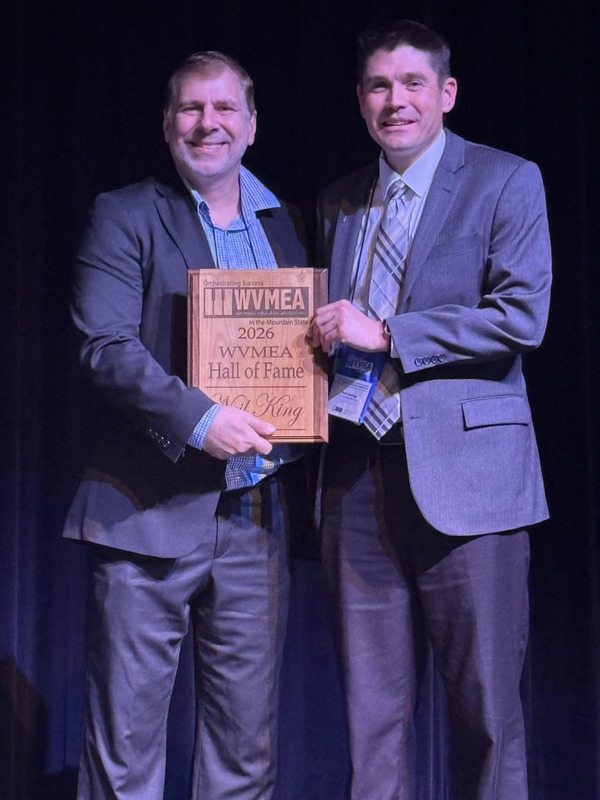 Mr. King accepting a plaque signifying his induction into the WVMEA Hall of Fame