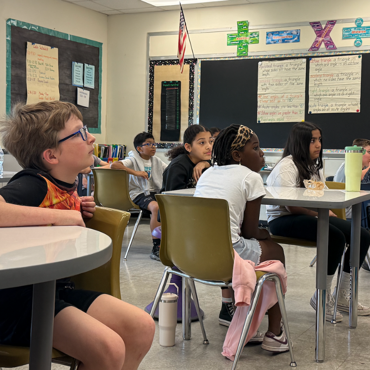 students in class watching a presentation