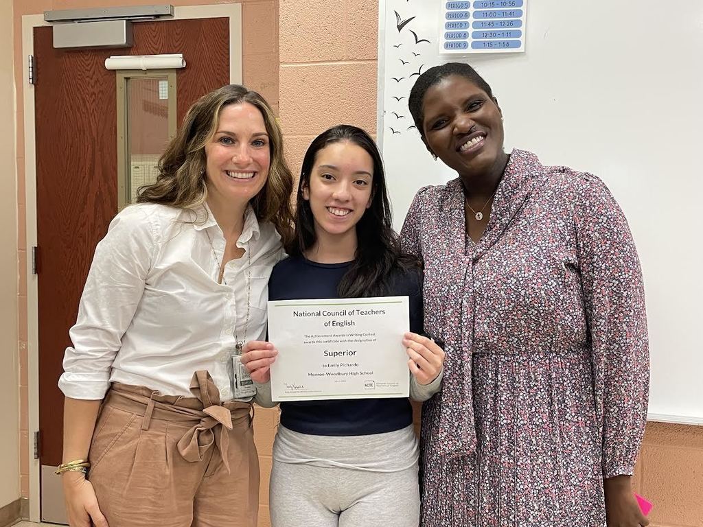teacher, student with certificate and administrator