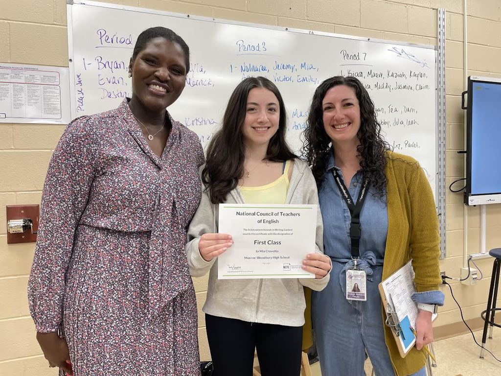 administrator, student with certificate and teacher