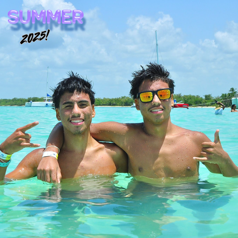 two brothers one wearing yellow sunglasses at the beach