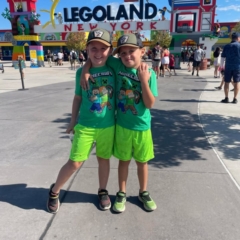 two brothers with green shirts and shorts