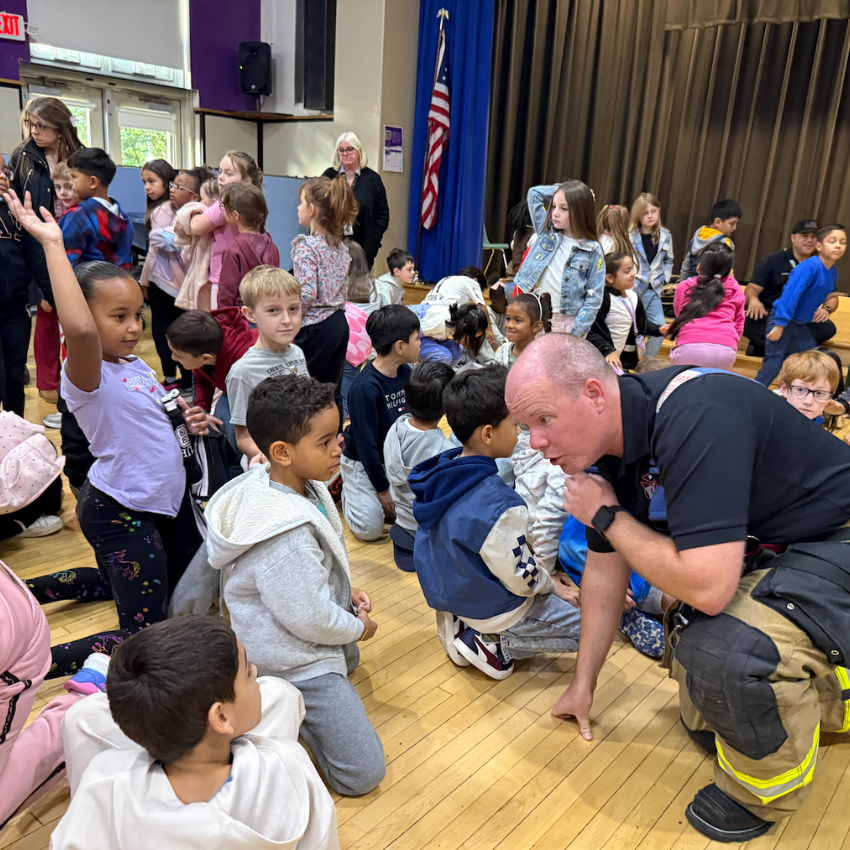 fire fighter talking to students 