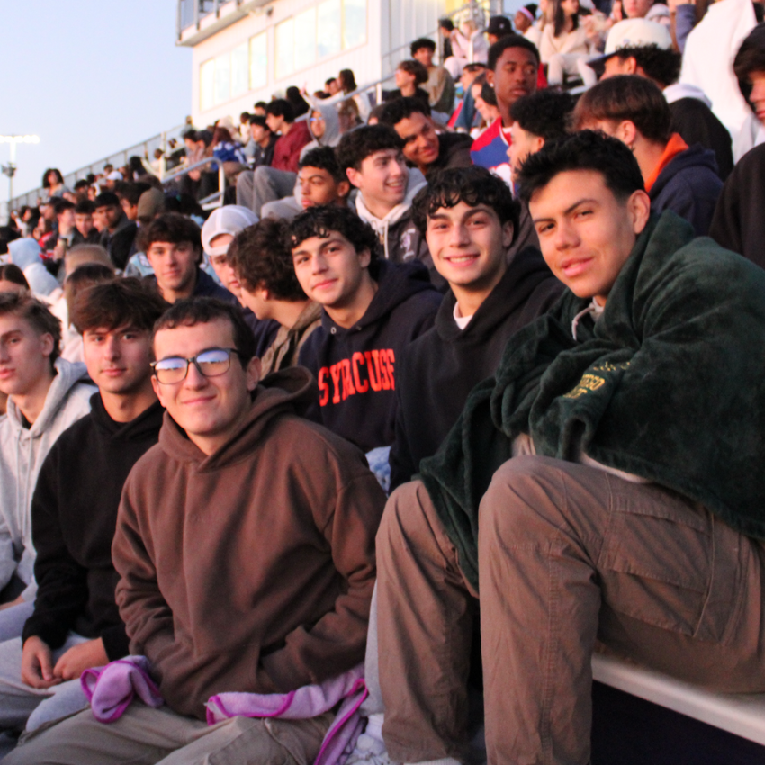 students sitting in the bleachers 