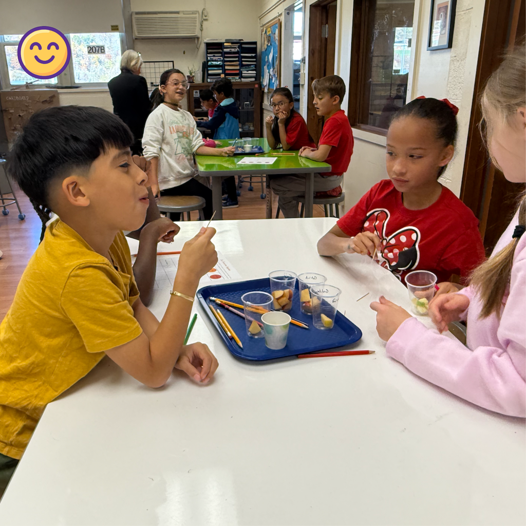 student tasting apple