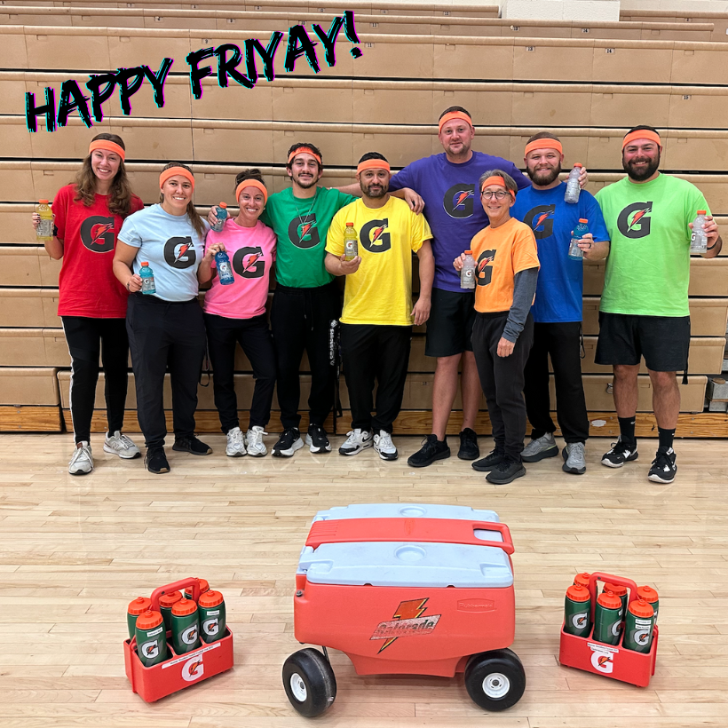 adults wearing different color shirts with a G sign on it. 