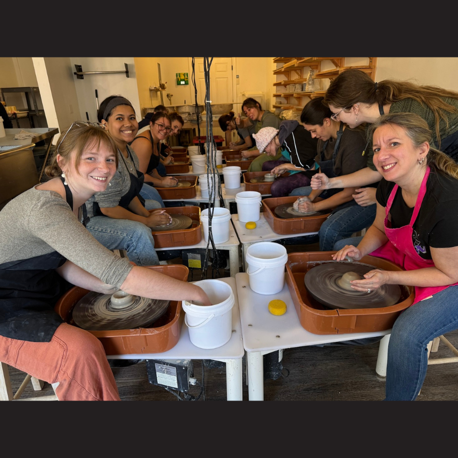 photo of people smiling doing pottery
