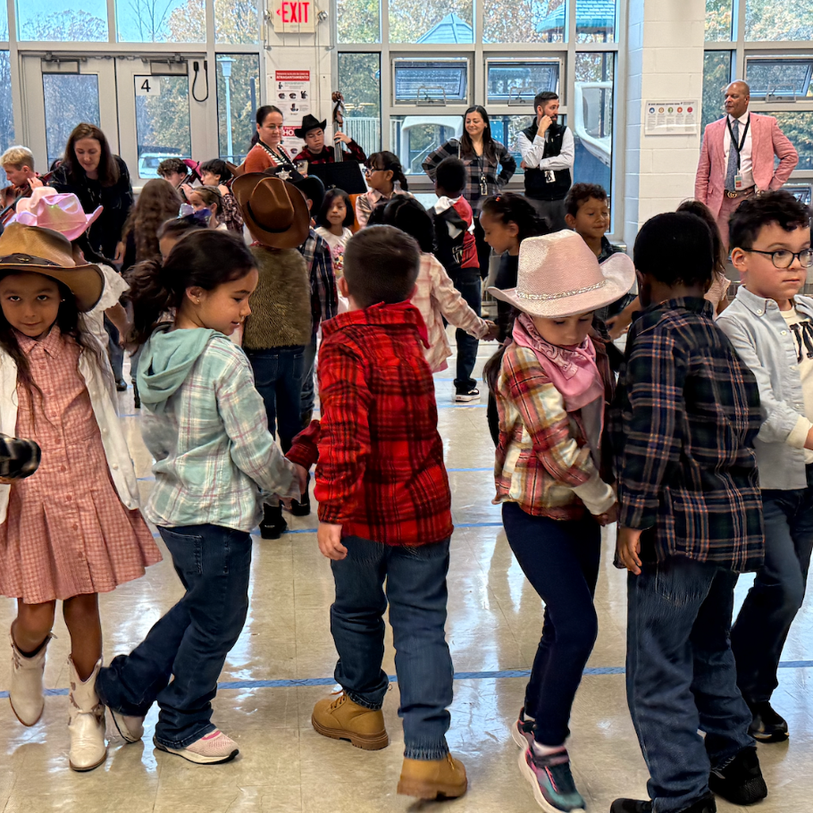 students dancing with cowboy boots and hats