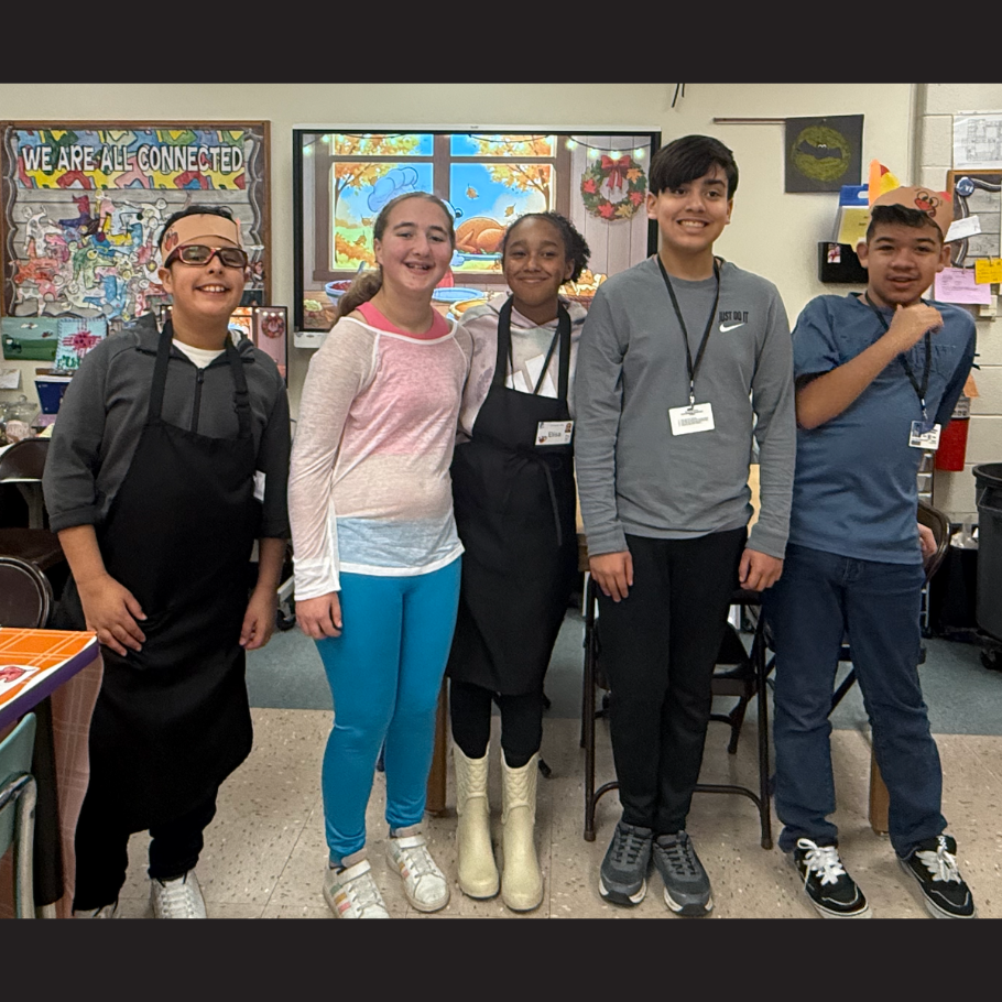 five students standing with black, white and grey shirts