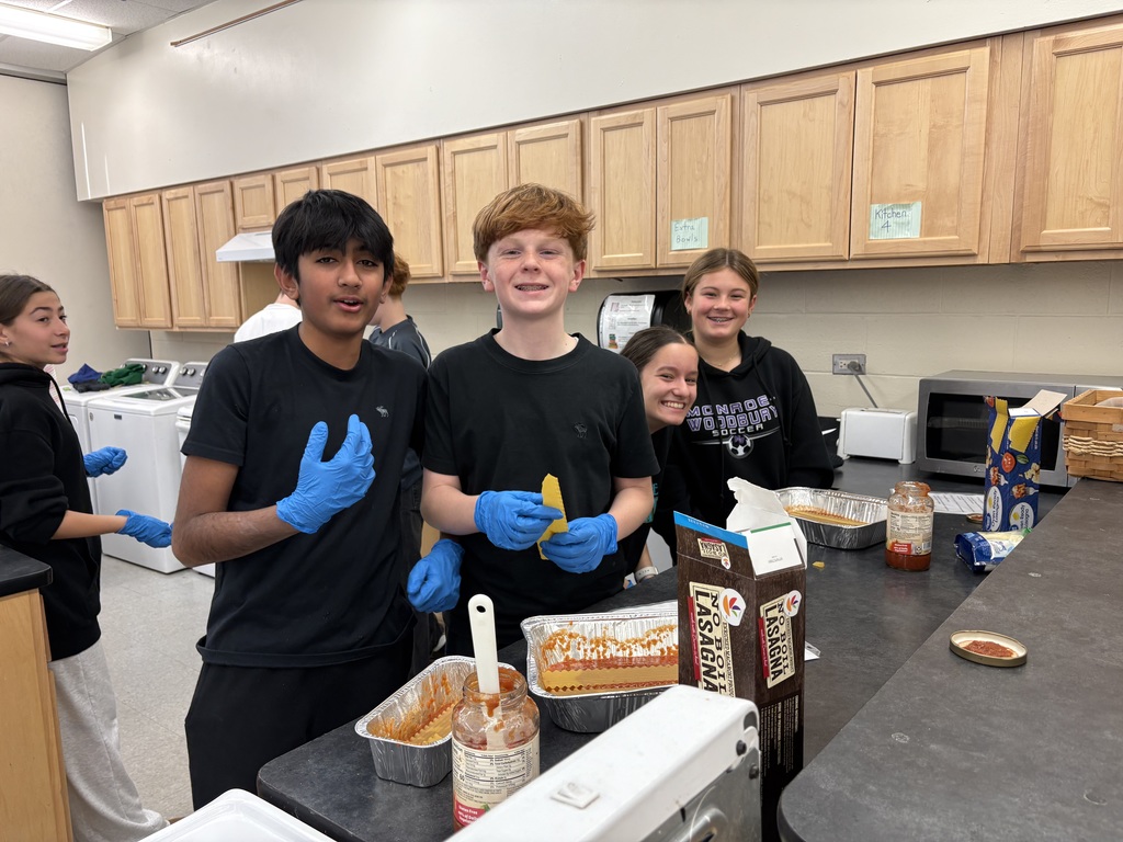 students making lasagna for senior citizens