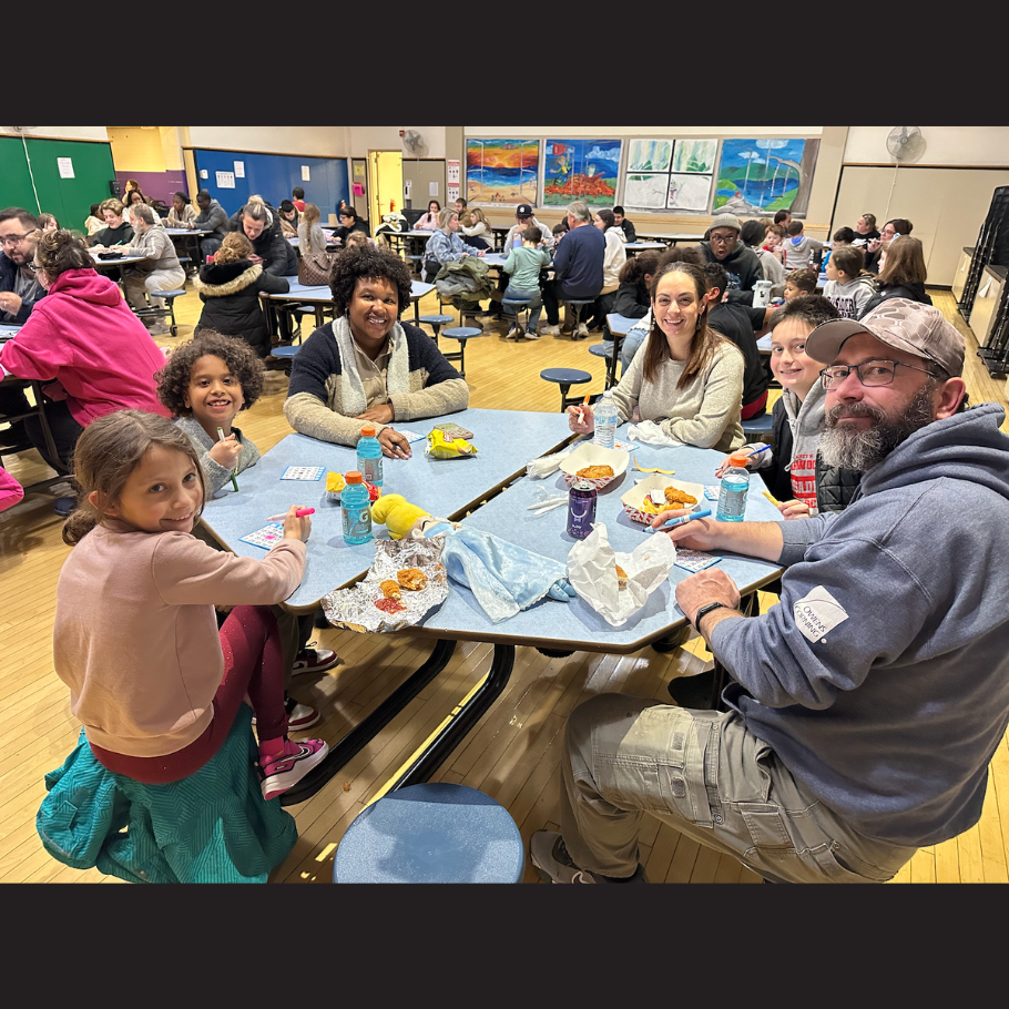 people sitting around a blue table 