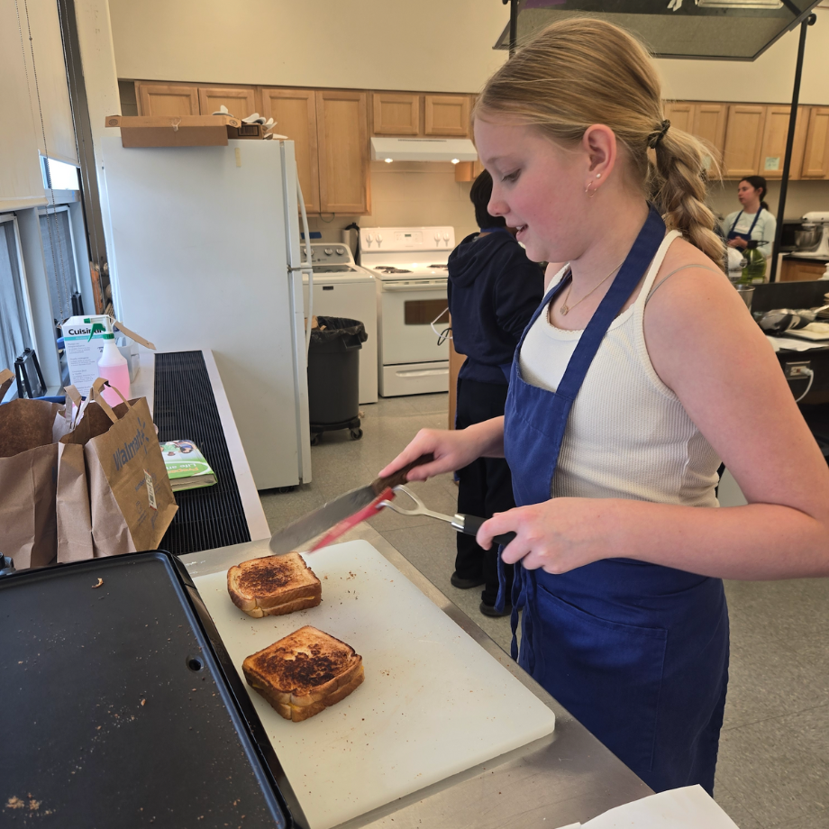 student cutting a sandwich 