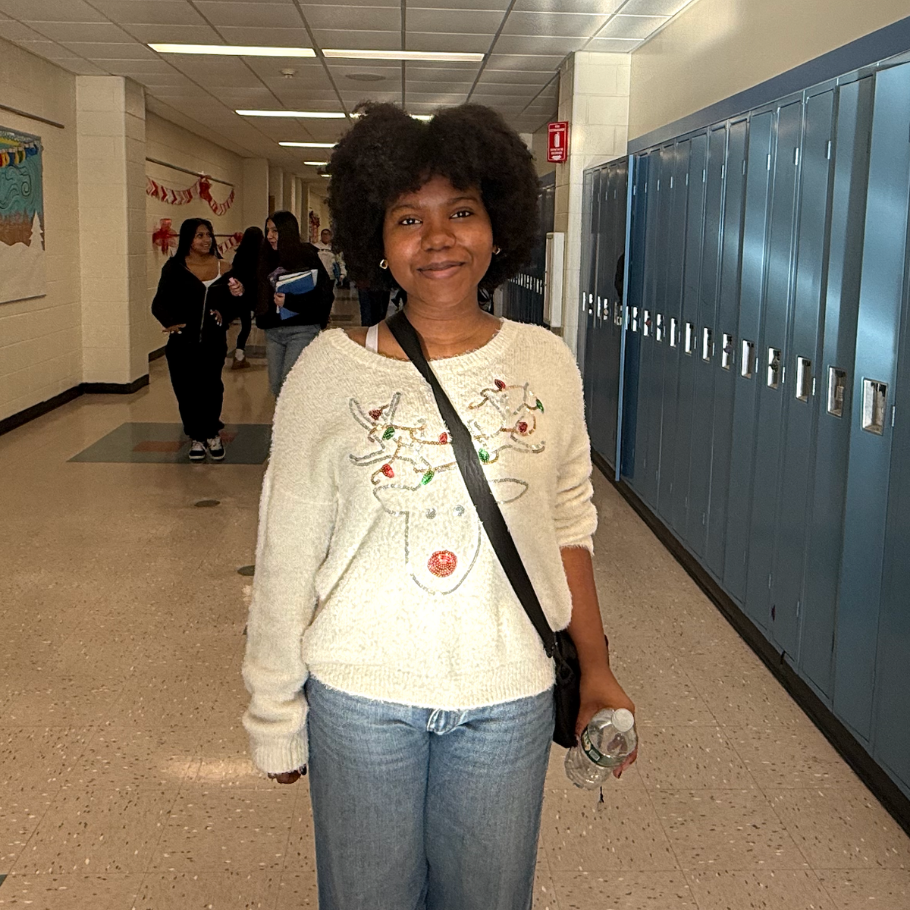 girl wearing white sweater with reindeer 
