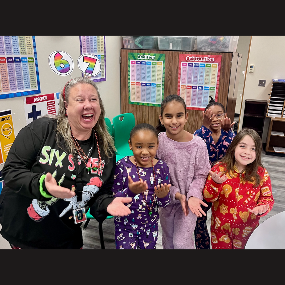 students and teachers in pajamas with a 6 7 on headband