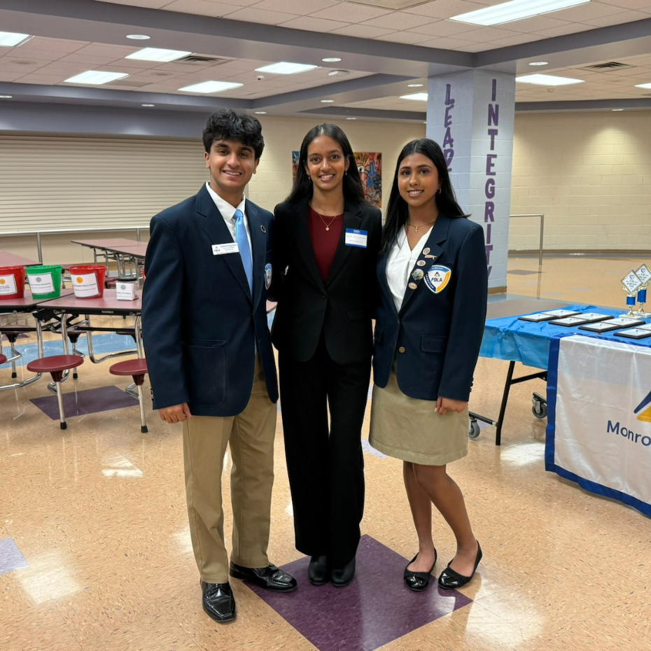 three students with blue jackets
