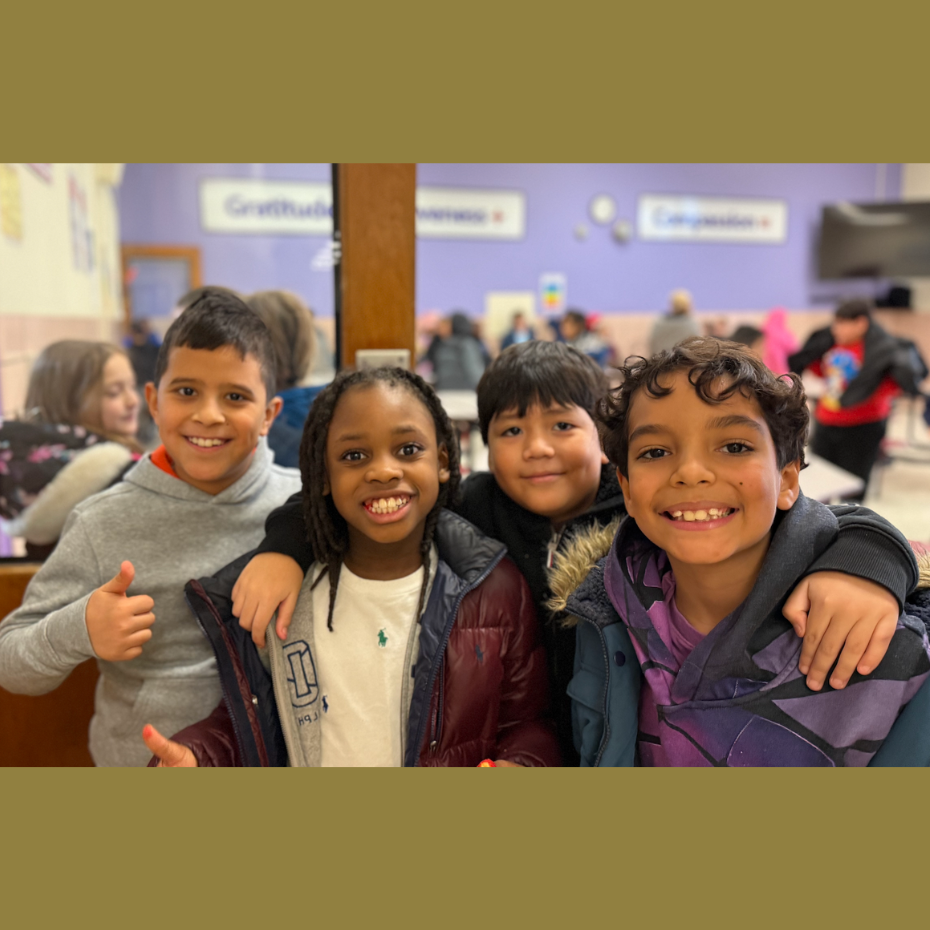 four students smiling