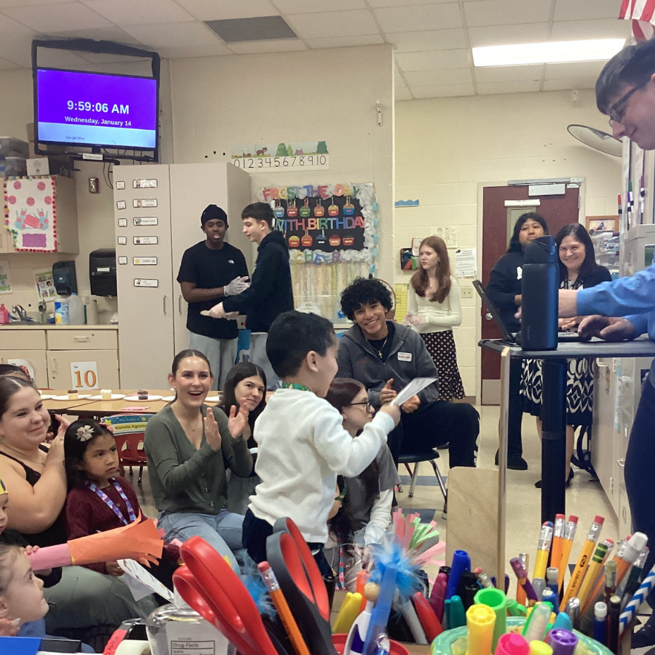 students standing with certificate
