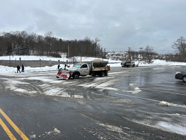 clean up crews and trucks in snow