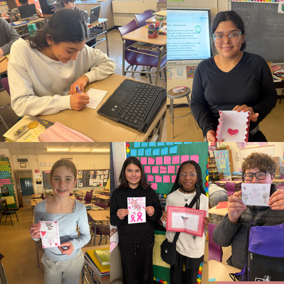 students holding cards 