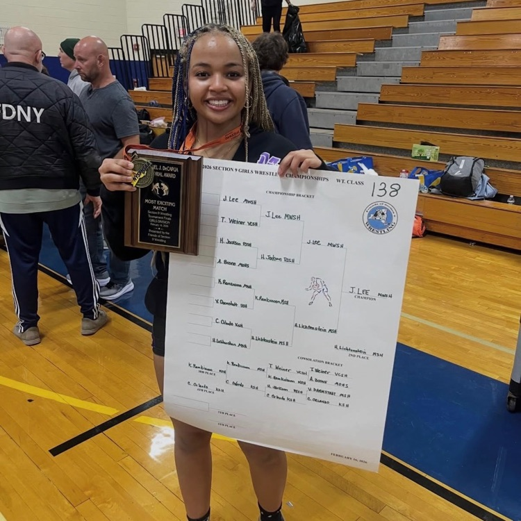 girls wrestling champion holds award