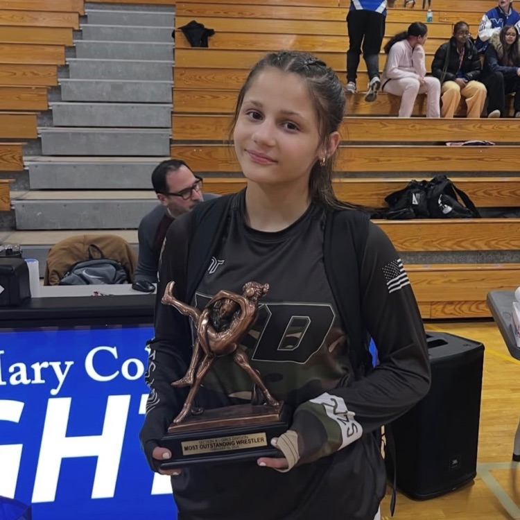 wrestling girl champion holds statue