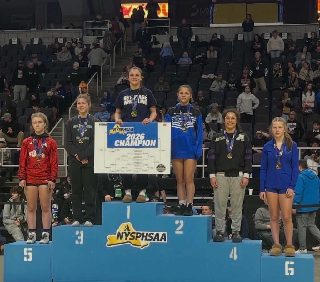 Wrestlers on award podium