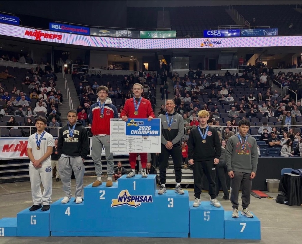 Wrestlers on award podium
