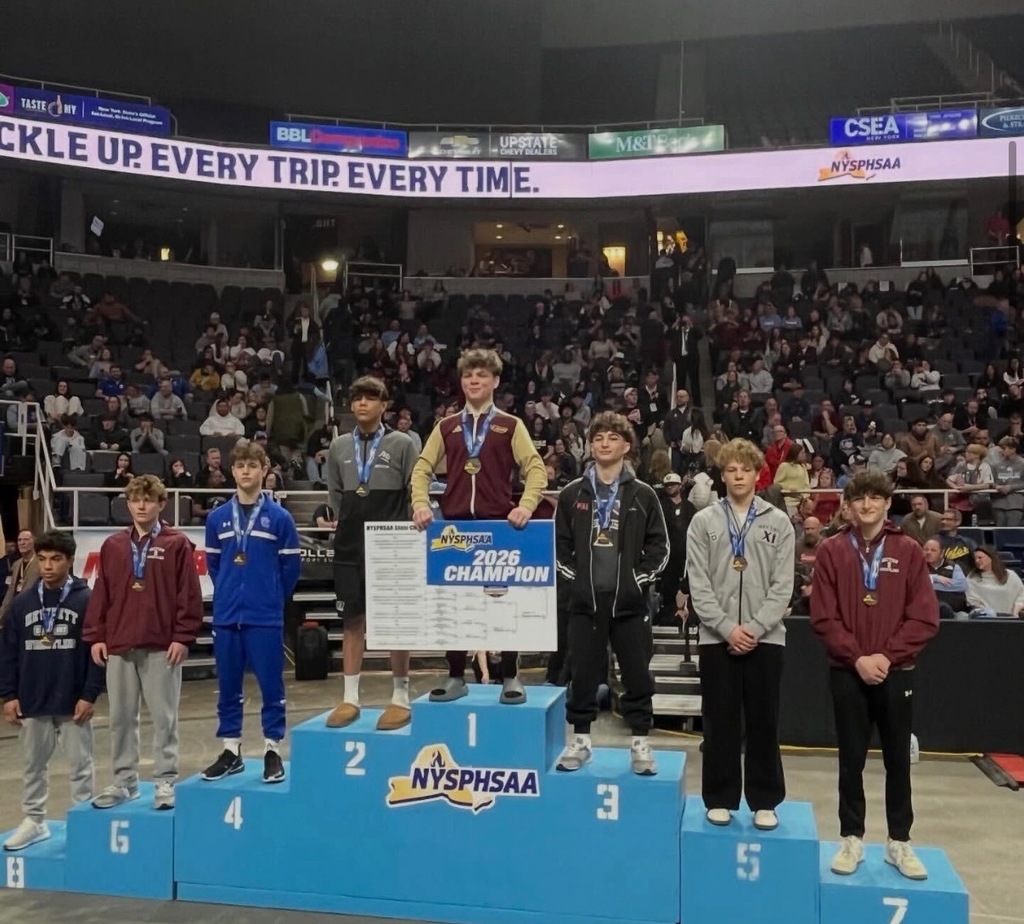 boy wrestlers on winners podium