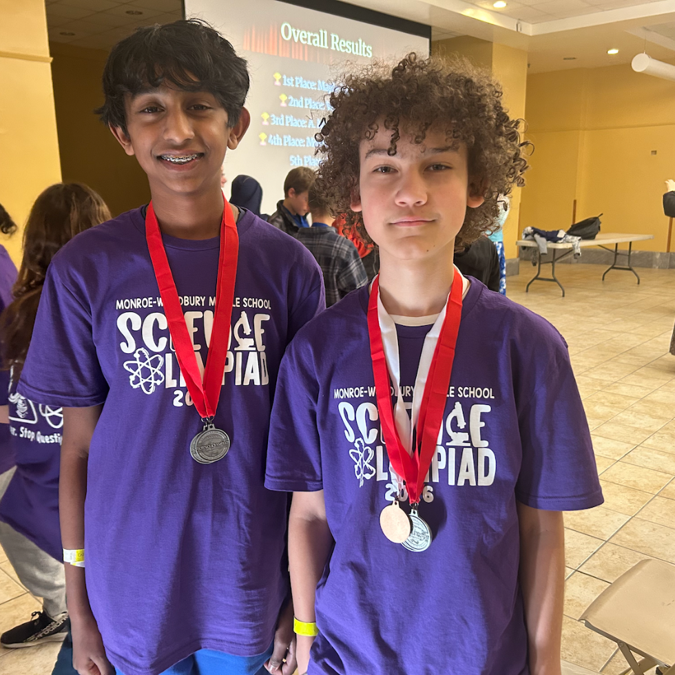 two students with medals 