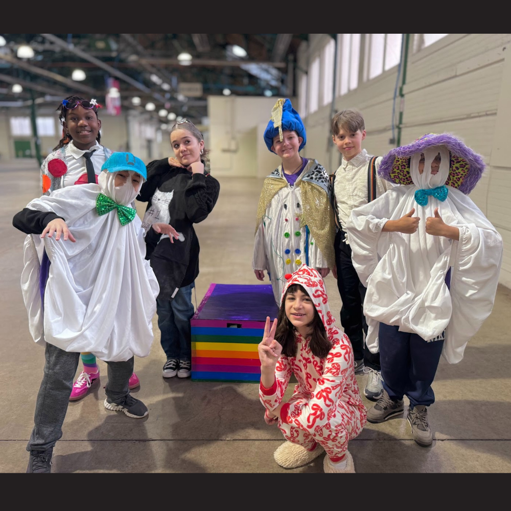 seven students wearing costumes