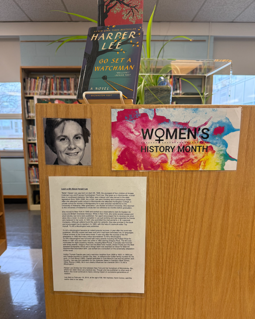 a display of books, women's history month