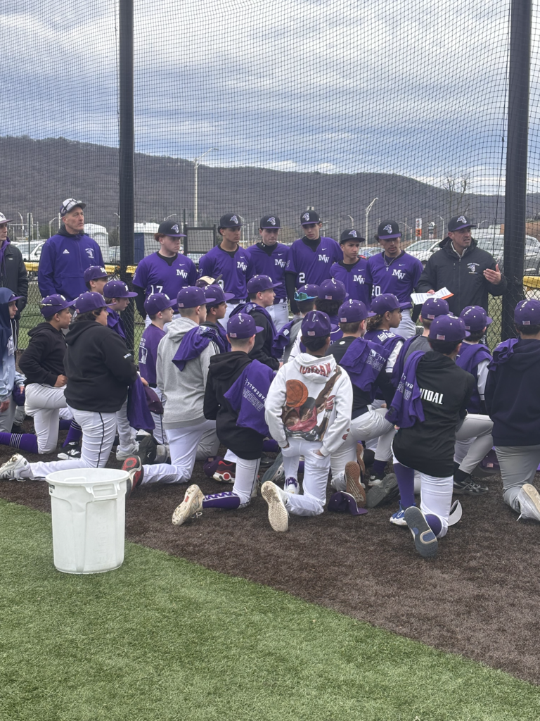 baseball players kneeling