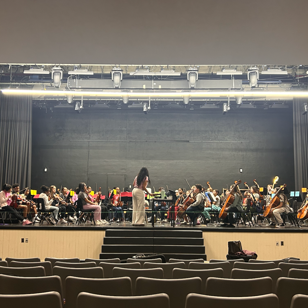 auditorium with students in orchestra practice 