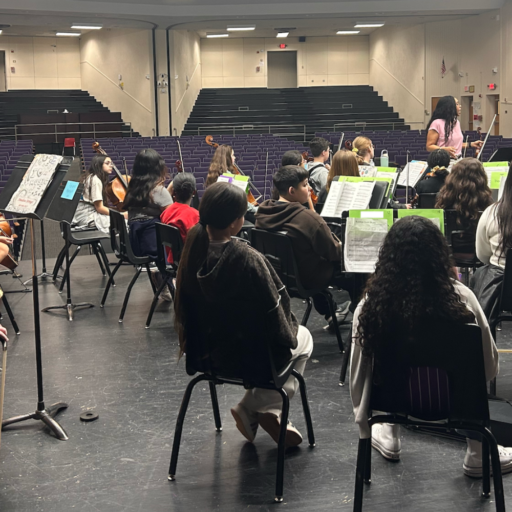 student sitting during orchestra practice 