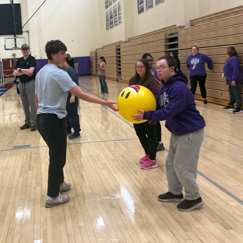 student holding a giant ball