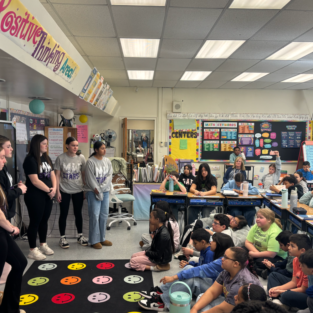 student sitting on a rug