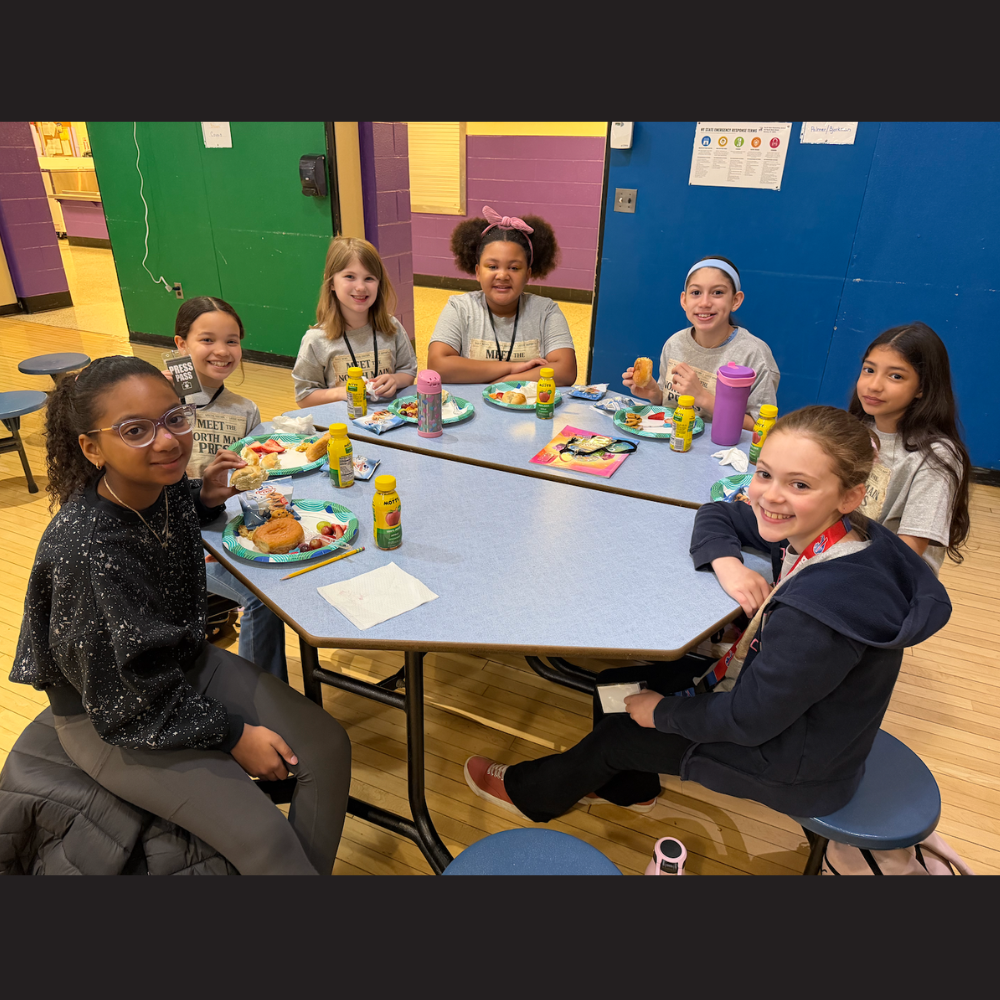 students sitting at table 
