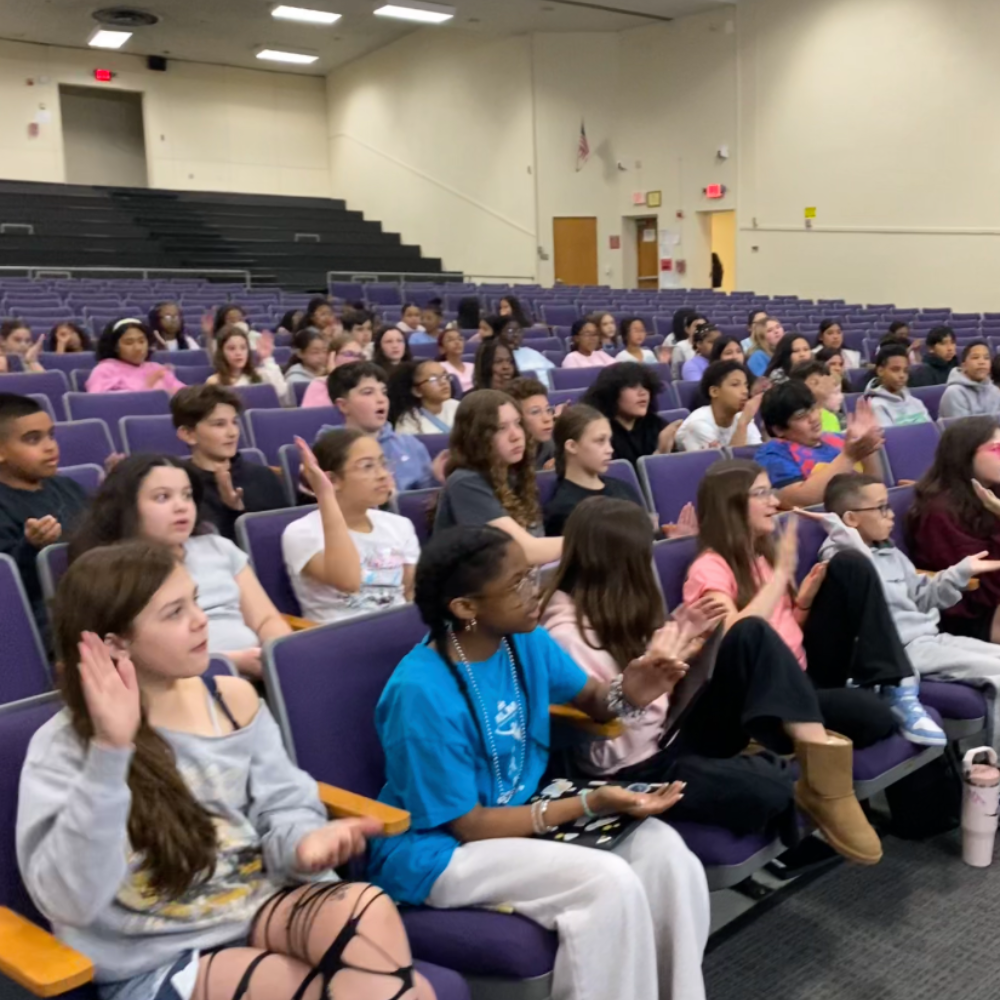 students sitting in an auditorium