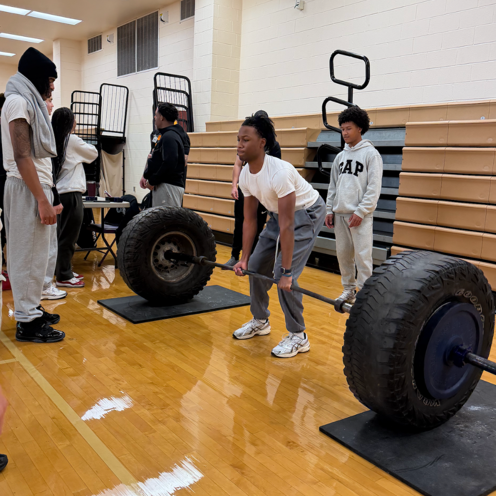 GAP, student lifting tires 